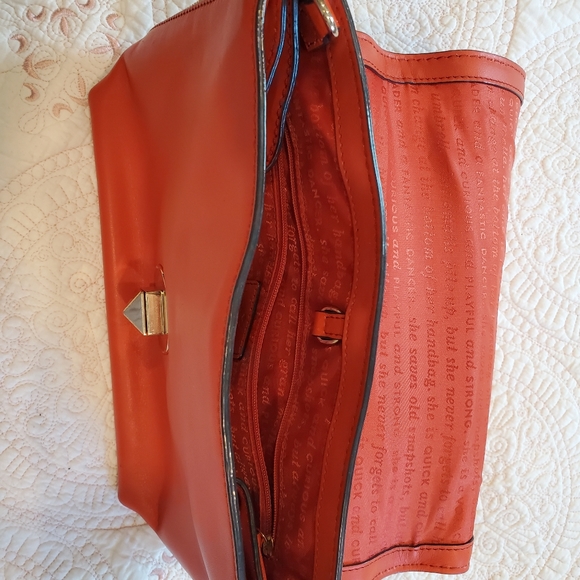 Kate Spade orange leather purse.  12" x 9" Two side zippers three inside pockets - Picture 8 of 11